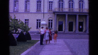 1961: a man and a woman shake hands in front of a building SWITZERLAND