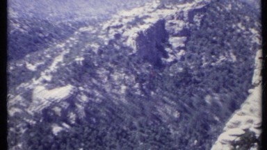 1971: aerial view of a craggy mountain range. CALIFORNIA
