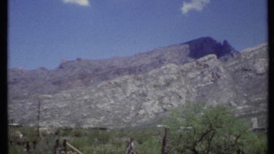 1971: mountains, a highway ,a house near mountains and road CALIFORNIA