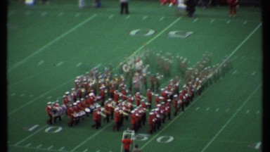 1979: a group of people marching in the playground before the match starts