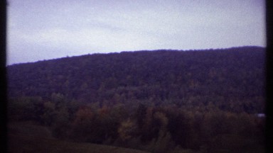 1979: footage of hill scenery taken from a car. ITHACA NEW YORK