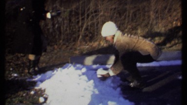 1979: two girls are playing with snow, making snowballs ITHACA NEW YORK