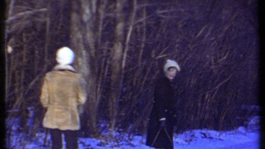 1979: couple pulls sled in the snow and have an impromptu snowball fight. ITHACA