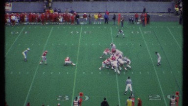 1979: a game of rugby is played by 2 teams , people are watching ITHACA NEW YORK