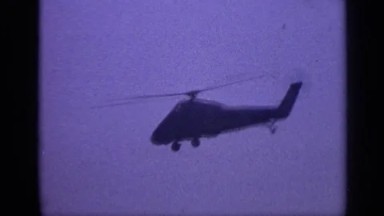 1970: A Large Helicopter Flying in the Blue Cloudless Clear Sky UNITED KINGDOM