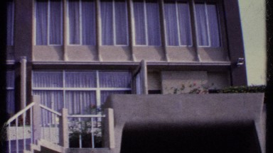 1969: A Large Building with Numerous Windows and a Beautiful Staircase