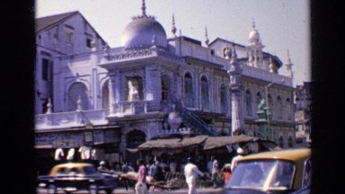 1970: the people are shopping in front of the huge building INDIA
