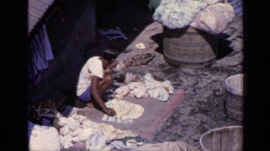 1970: this indian man is shown washing clothes off