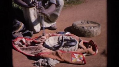1970: Indian Man Charms Snake with Pungi Flute in Traditional Performance