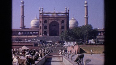 1970: People Gathered Near Building in India