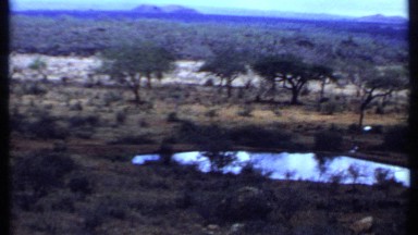 1969: a nature seen that has the beautiful mountain and trees with little water