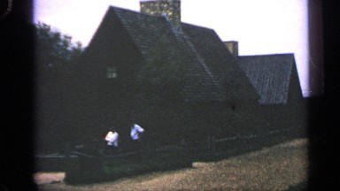 1969: two guys are talking about their old memories at the front of their house
