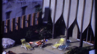1969: Persons Relaxing in Chairs Under Umbrellas in Thailand