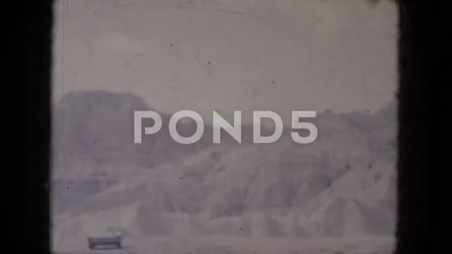 1969: Sailing Along Past Homes on a Lake Shoreline, BAHAMAS