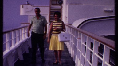 1969: a couple walking on a boardwalk BAHAMAS