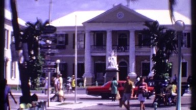 1969: the people are walking on the platform in front of building BAHAMAS