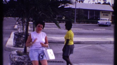 1969: lady crossing the road where no vehicles are coming BAHAMAS