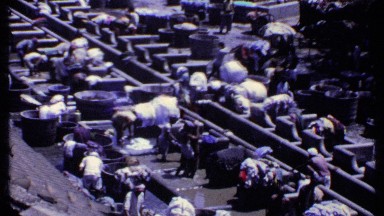 1969: People Washing Clothes at Stone Water Tank in India