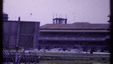 1969: panning footage of a large horse race track. INDIA