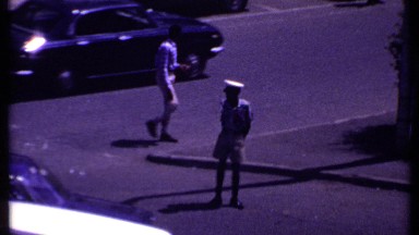 1969: road is full of traffic during morning and a shop near the road KENYA