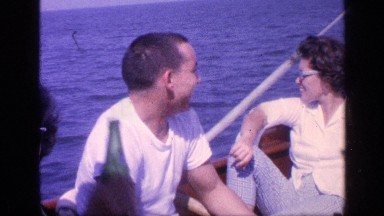 1968: people on a boat on the water, talking and laughing FLORIDA
