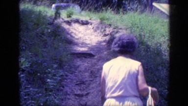 1968: a girl is walking in the garden FLORIDA