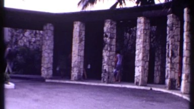 1969: Many People Entering Buildings with Luggage in Bahamas