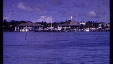 1969: footage of a beautiful seaside town taken from a boat. BAHAMAS