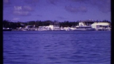 1969: Voyage Through Blue Waters Near Bahamian Port
