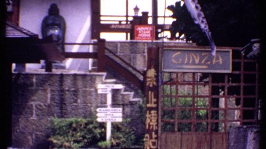 1969: panning up close view of an asian town. BAHAMAS