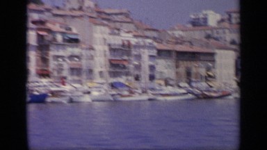 1963: Smaller Ships Docked at Harbor Without Crew