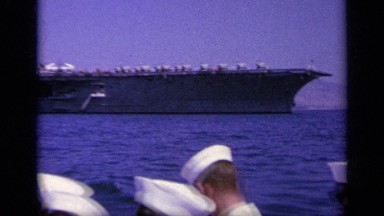 1963: the crew of a gigantic american warship traveling in a small boat GREECE