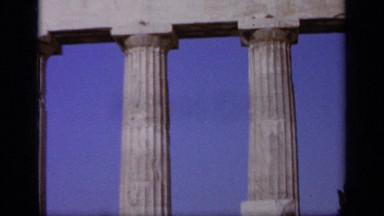 1963: Soldier and Sailor Pose Together by Rigid Columns and Stone Blocks GREECE