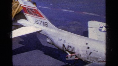 1963: Aerial View of Fighter Plane in Disrepair Aboard a Navy Ship in Greece