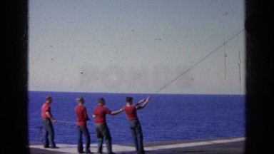 1963: Sailors Lower Destroyed A-7 Aircraft Onto Naval Ship Deck