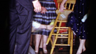 1966: bride and groom play lego guessing game MINEOLA NEW YORK