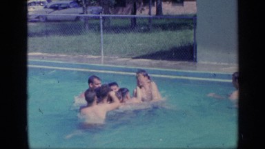 1968: the girls and boys are playing on the swimming pool FLORIDA