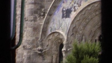1962: Church Building and Statue at Top of Hill with Arch