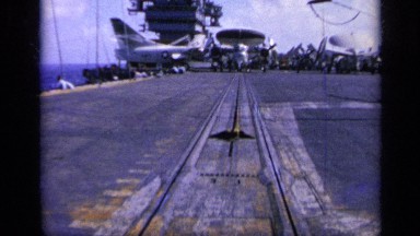1962: a navy at middle of the ocean, aircraft landed, water around ITALY