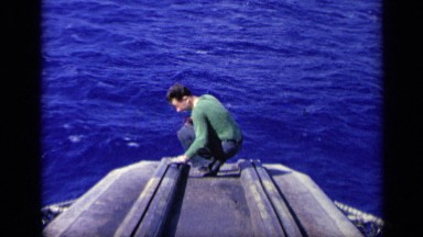 1962: man looking under water ITALY