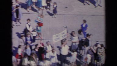 1962: crowd of people wave to navy personnel on a ship. ITALY