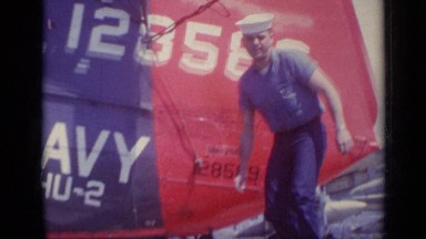 1962: marine in front of helicopter waving ITALY
