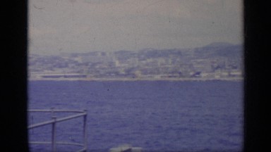 1962: a wonderful view of a deep blue ocean and a distant beach shore ITALY