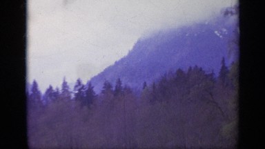 1962: Misty Mountain Fog Traveling Across Green Hillside Italy