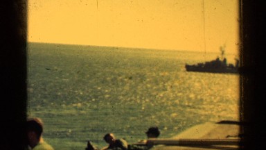1962: Sunset at the Beach with People Standing Near the Shore
