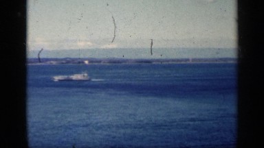 1962: camera pans on ocean scene boat and aircraft. CUBA