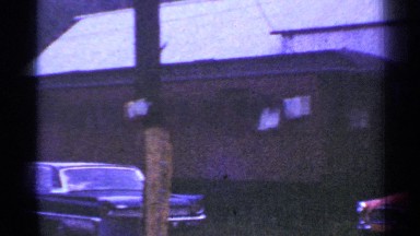 1953: Train Stopped on Tracks with Caboose and Cars in Connecticut