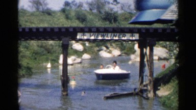 1959: people are travelling in boat DISNEYLAND