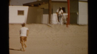 1959: a guy is moving the dustbin, a boy is running SAN FRANCISCO