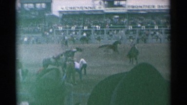 1961: People Watching Horse Game in Cheyenne Wyoming